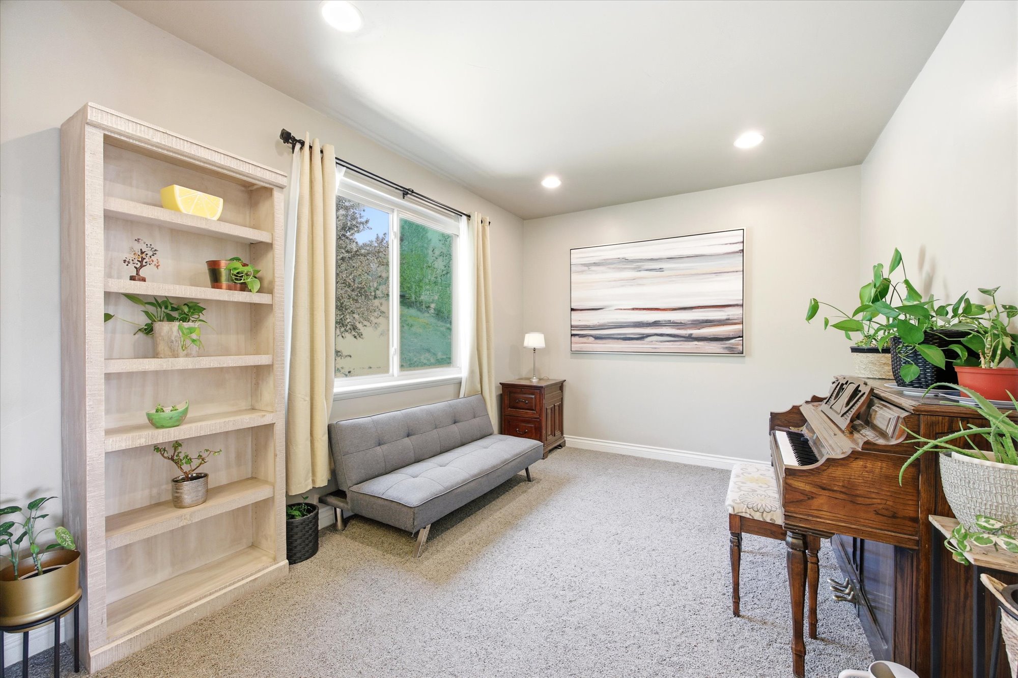 Neutral tone walls with recessed lighting and crown molding