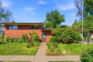 Red brick facade with a complementary shingle roof