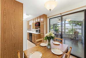 Dining area with sliding glass doors opening to a screened porch