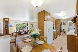 Kitchen featuring wood-finish cabinetry and white countertops