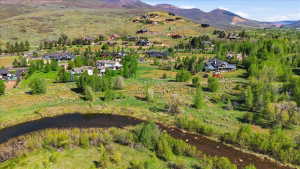 Expansive natural landscape featuring a winding river and lush green foliage