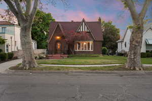 Brick exterior featuring a steeply pitched roof, prominent front gable, and decorative half-timbering
