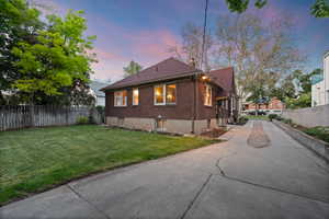 Brick exterior home with a gabled roofline