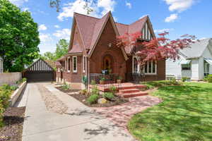 Brick exterior with a steep gabled roof and decorative timber accents