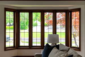 Bay window with detailed muntins and rich wood-finish trim
