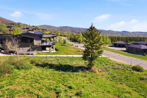 Modern architecture featuring a dark-toned exterior with stone accents and a multi-level design