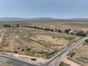 Overview of rural landscape featuring a mountainous background