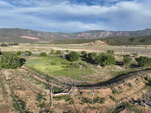View of mountain background featuring rural landscape