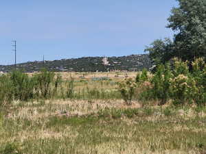 View of mountain background featuring rural landscape