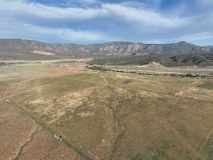 View of mountain backdrop with rural landscape