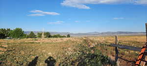 View of mountain background featuring rural landscape