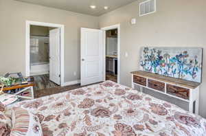 Carpeted room with neutral wall tones and white trim