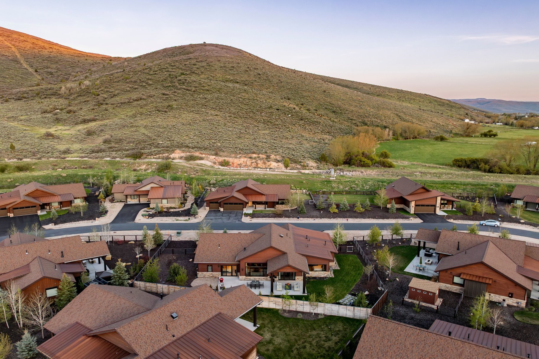 Modern residential development featuring a cohesive architectural style with brown siding and complementary roofing