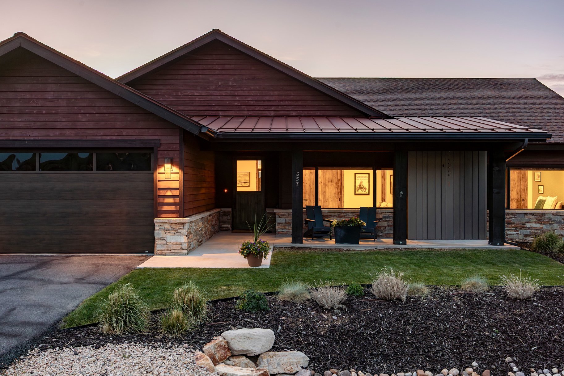 Contemporary exterior with rich wood-finish siding and stone accents
