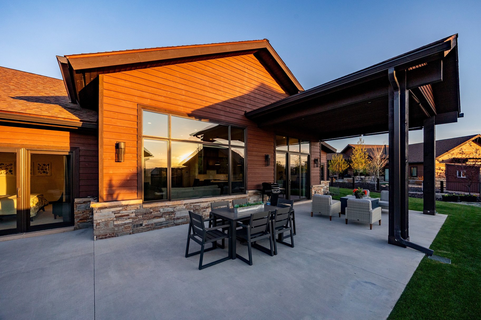 Expansive concrete patio offering a covered outdoor living area and an additional uncovered section