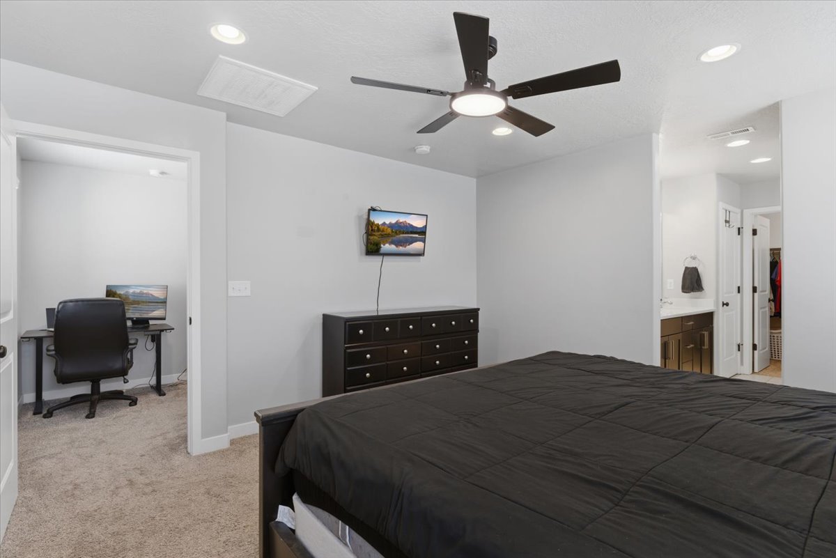 Bedroom featuring recessed lighting, a ceiling fan with integrated light, and soft carpeting