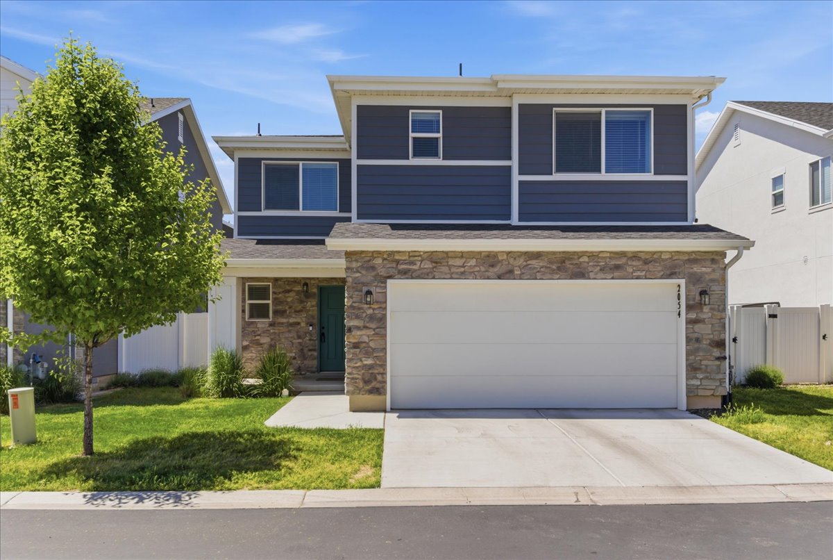 Contemporary two-story exterior featuring stone veneer and horizontal siding
