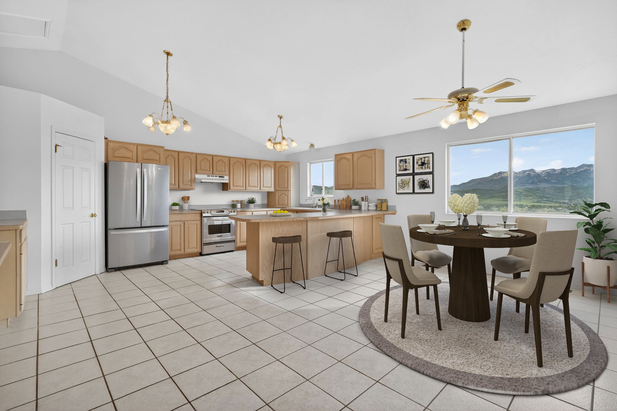Open-concept kitchen and dining area featuring vaulted ceilings, light wood cabinetry, a central island with bar seating, stainless steel appliances, and large windows