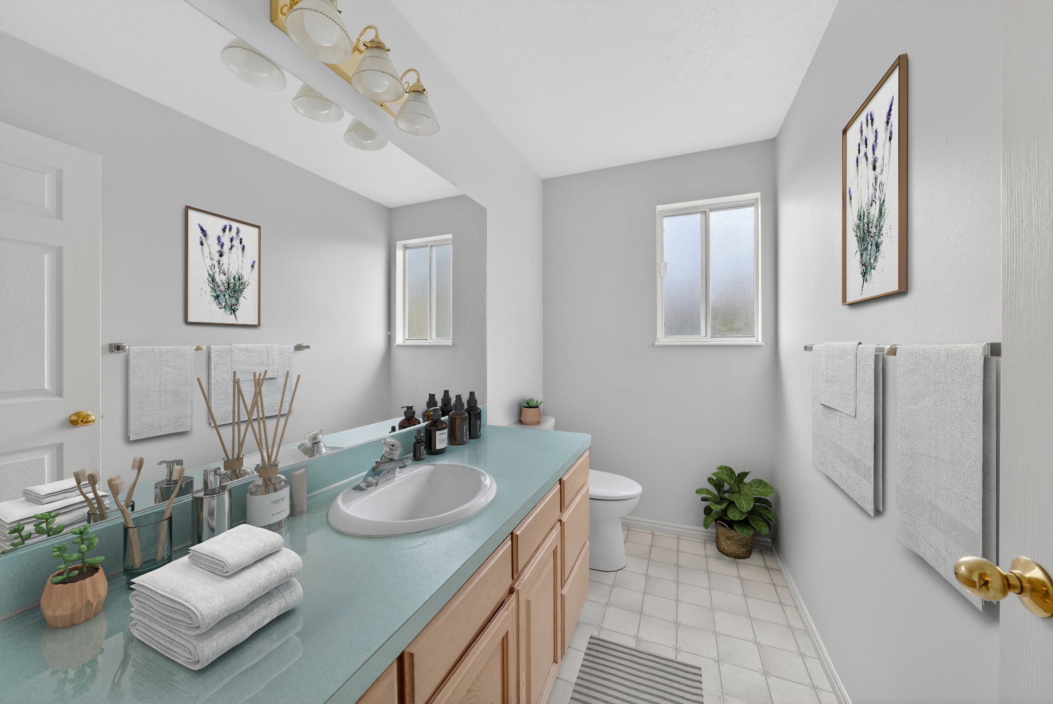 Bathroom featuring a light blue countertop with an integrated sink, wood-finish cabinetry, and a full-width mirror