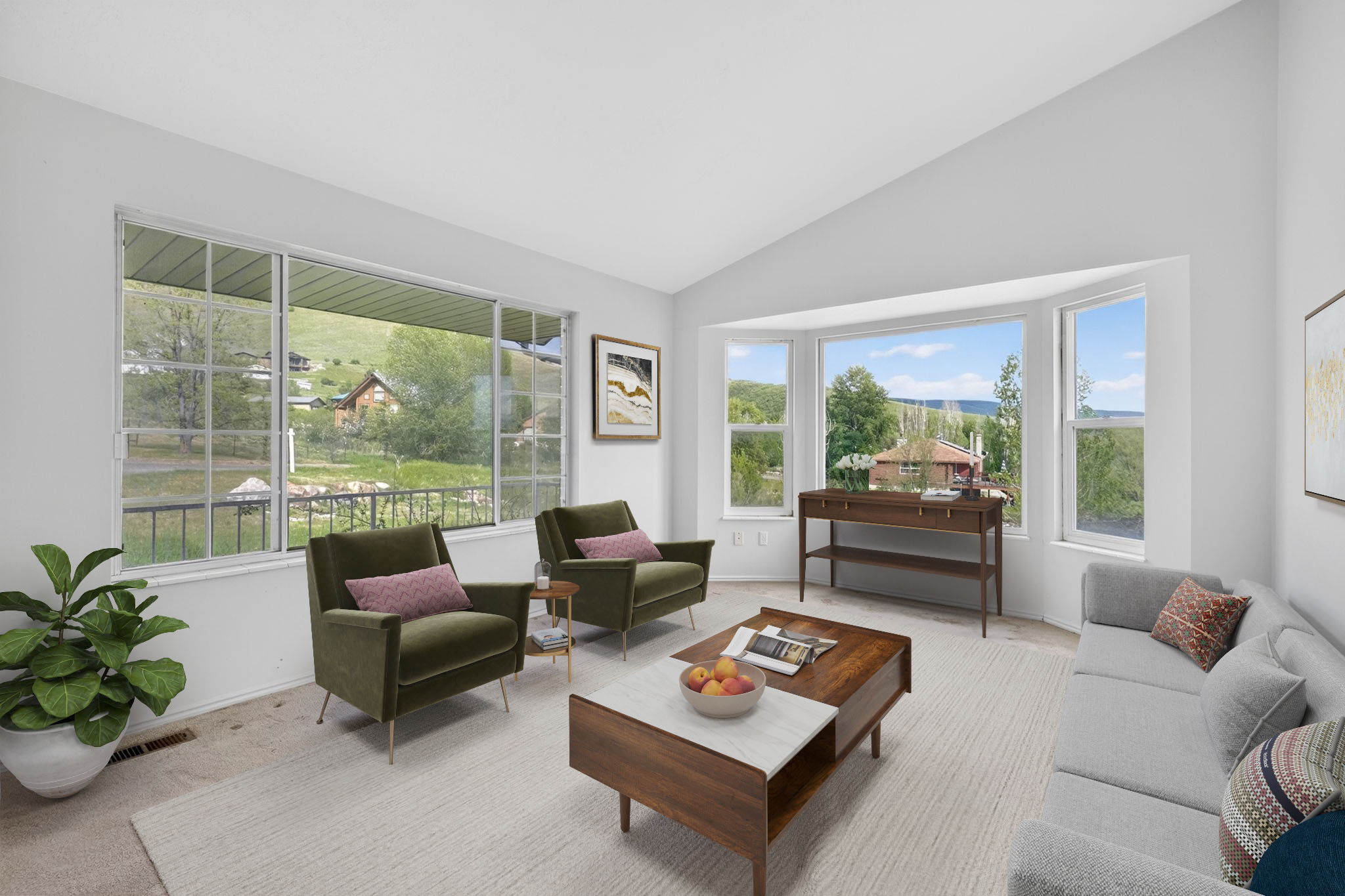 Living room featuring a vaulted ceiling and bay window