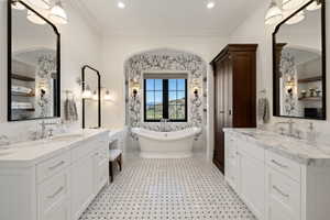 Freestanding soaking tub set against patterned wallpaper in an arched alcove