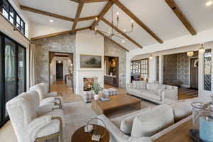 Vaulted ceiling featuring exposed wood beams
