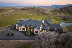 Sprawling estate featuring a stone and dark wood exterior
