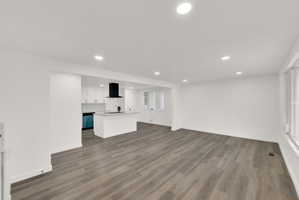 Spacious interior featuring wood-finish flooring and recessed lighting throughout