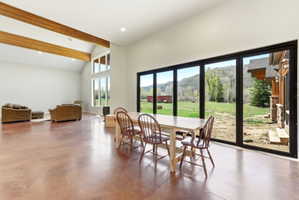 Expansive interior with polished concrete flooring and exposed wood beams