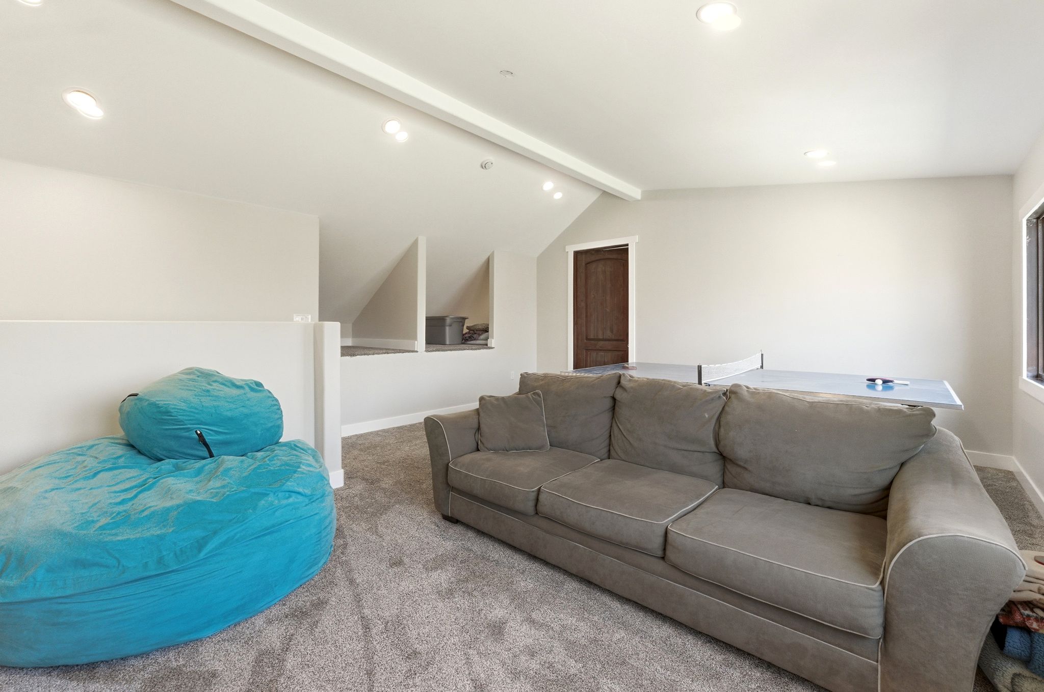 Spacious bonus room featuring recessed lighting, light gray wall paint, and gray carpet flooring