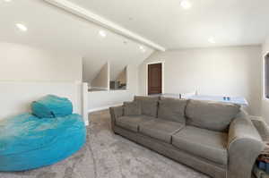 Spacious bonus room featuring recessed lighting, light gray wall paint, and gray carpet flooring