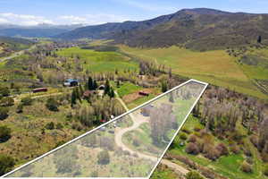 Aerial perspective showcasing property within a mountainous valley setting
