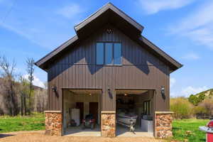 Two-bay garage with overhead doors and stone column bases