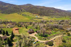 Expansive property featuring a multi-structure layout with a main residence and additional outbuildings