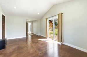 Vaulted ceilings complement the stained concrete flooring