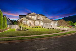 Modern traditional residence featuring a multi-gabled roofline and a two-car garage