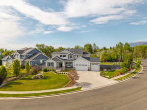 Spacious two-story residence featuring a combination of horizontal siding and stone accents