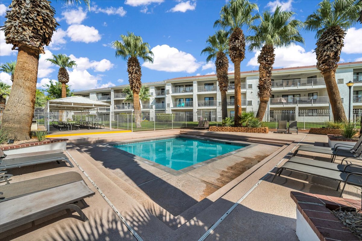 Outdoor swimming pool with integrated steps, surrounded by a concrete deck