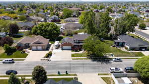 Residential property featuring a brick and siding exterior, an attached two-car garage, and a concrete driveway