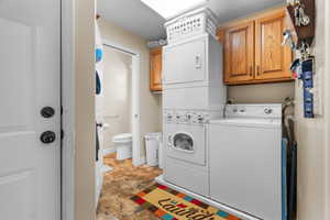 Laundry area with rich wood cabinetry