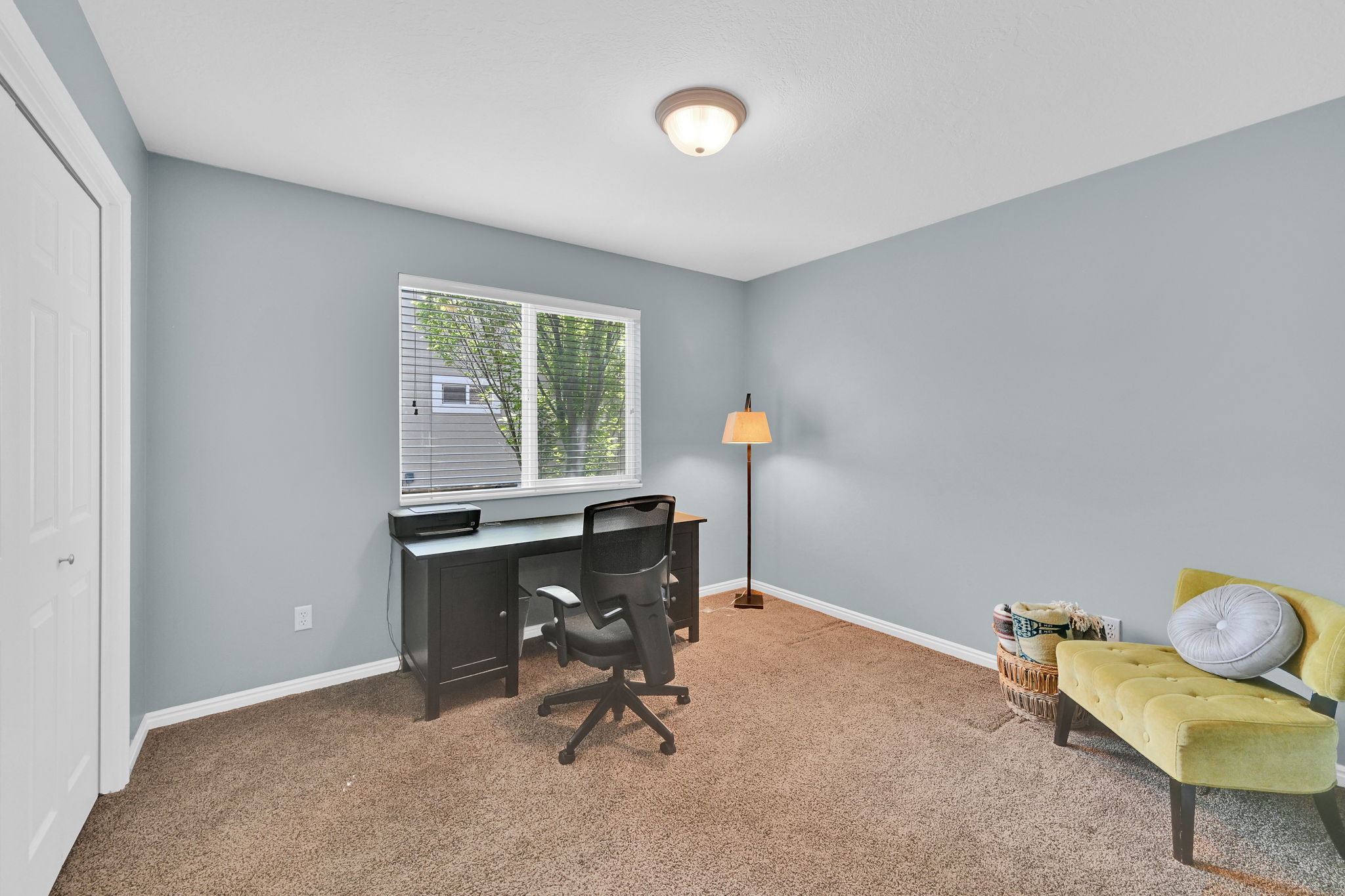 Bright room with carpeted flooring