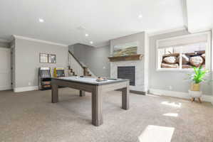 Spacious room featuring neutral carpet flooring and light gray walls