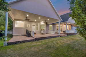 Spacious covered patio with recessed lighting and ceiling fans