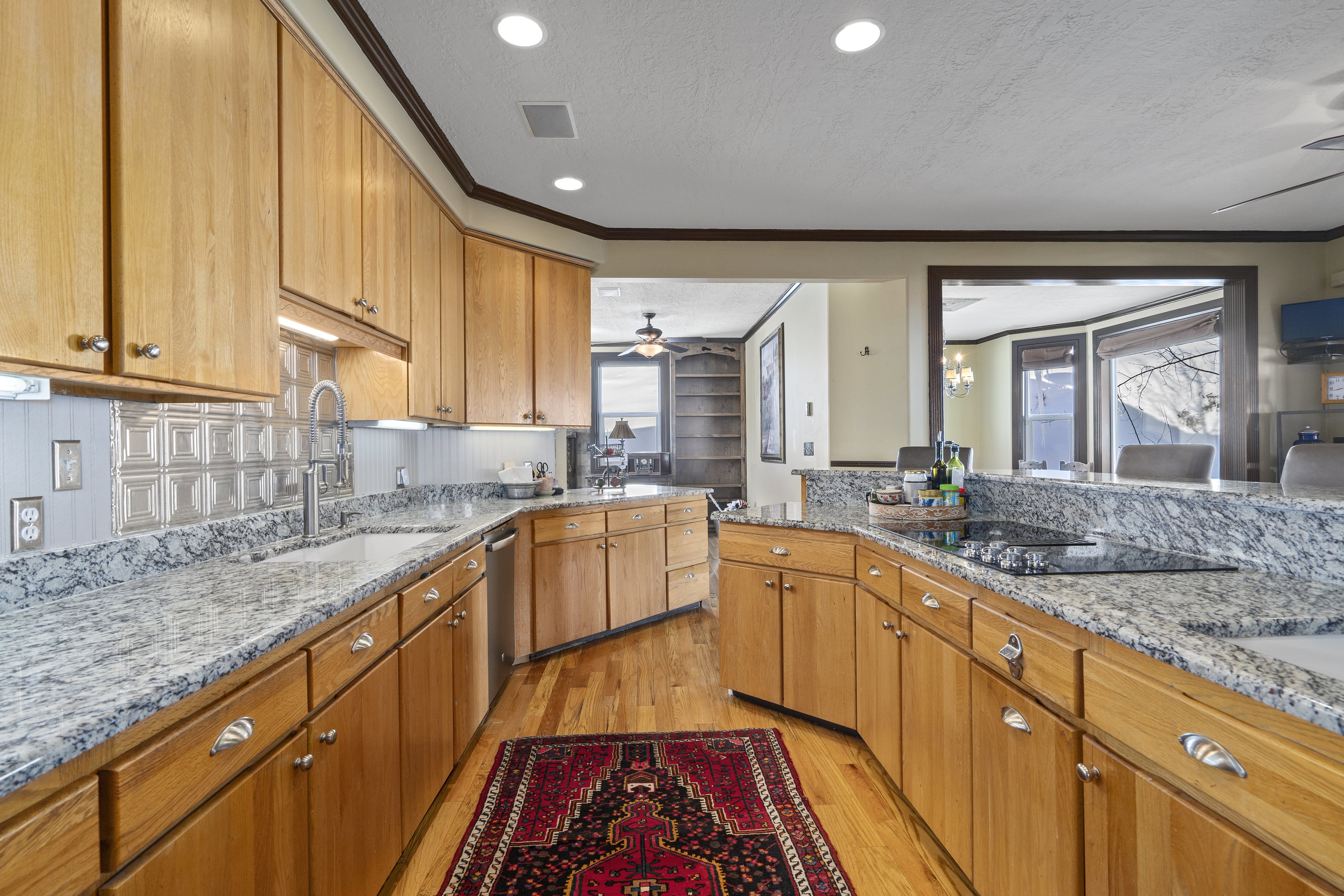 Kitchen featuring light wood cabinetry and granite countertops