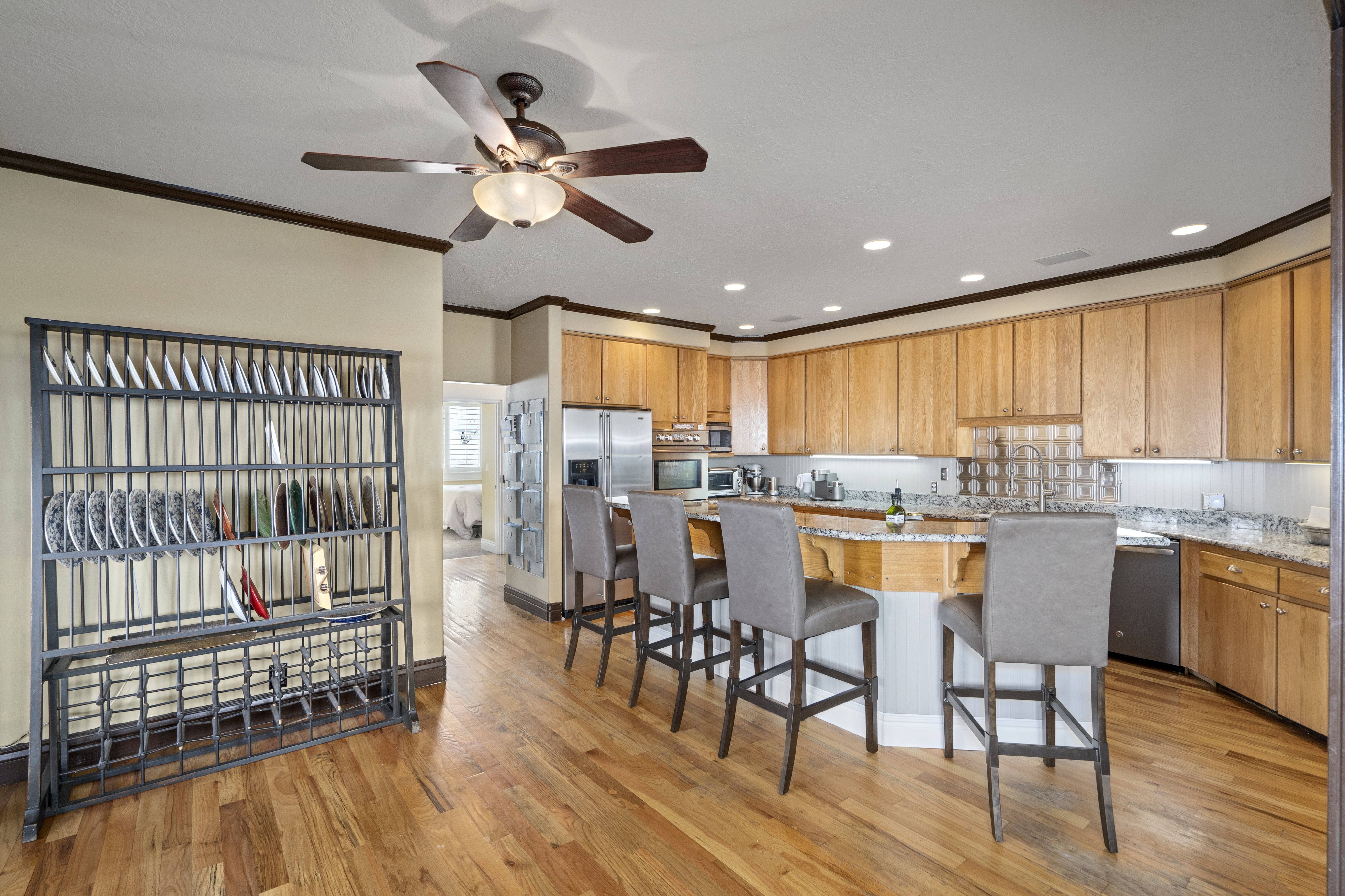 Kitchen featuring wood-finish flooring, recessed lighting, and a ceiling fan