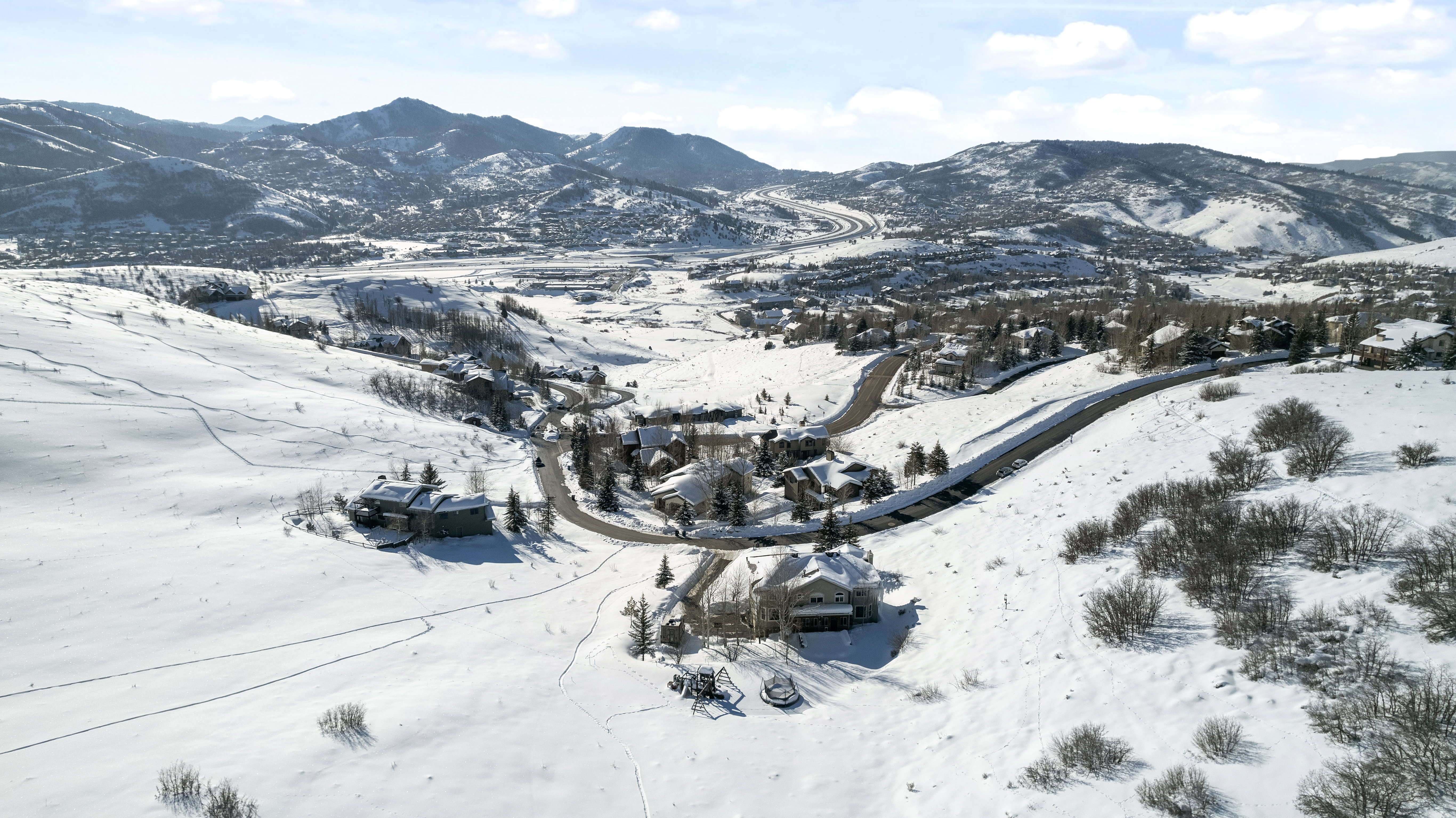 Snow-covered landscape with distant mountains