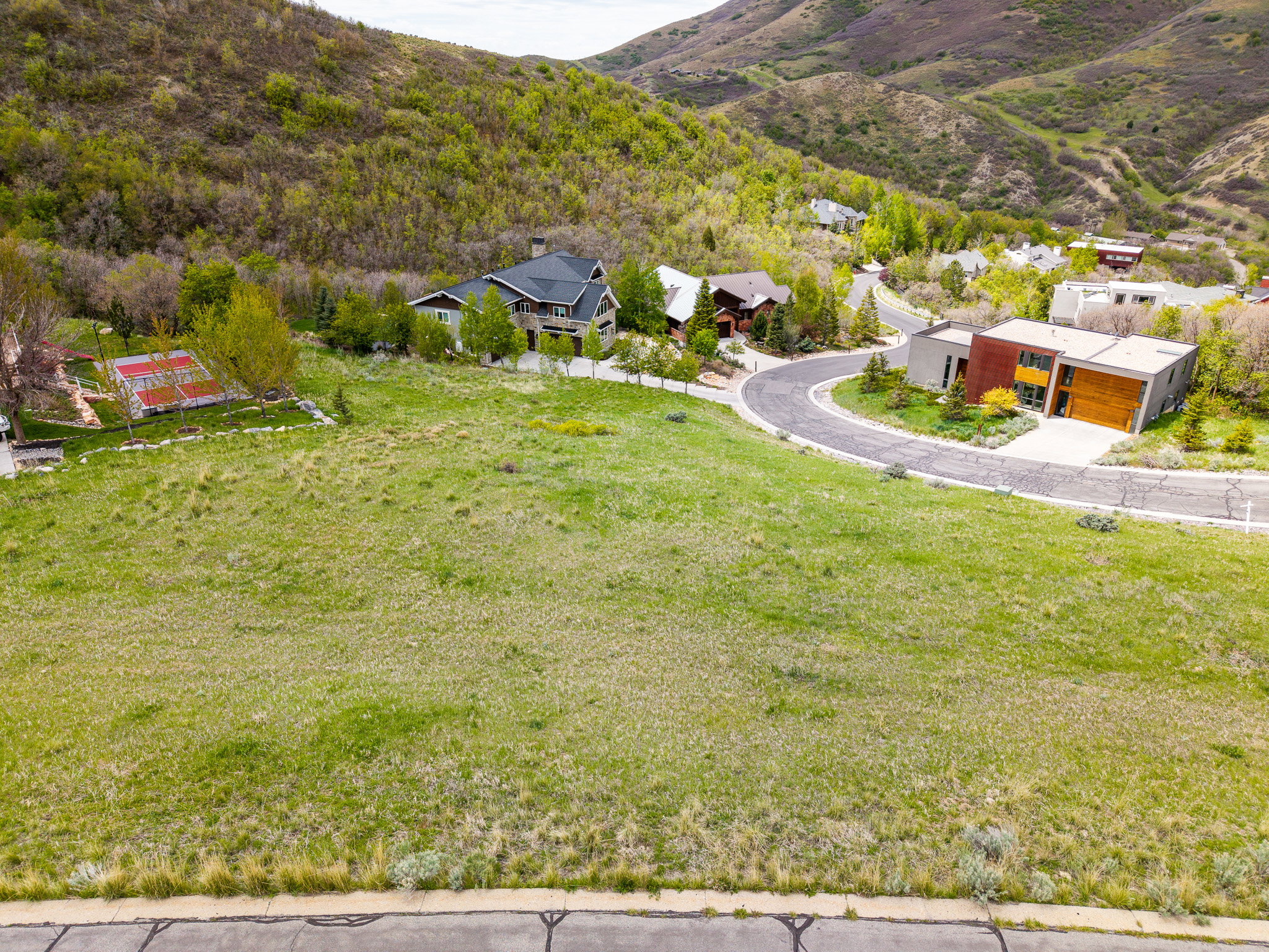 Expansive undeveloped lot featuring a grass-covered terrain