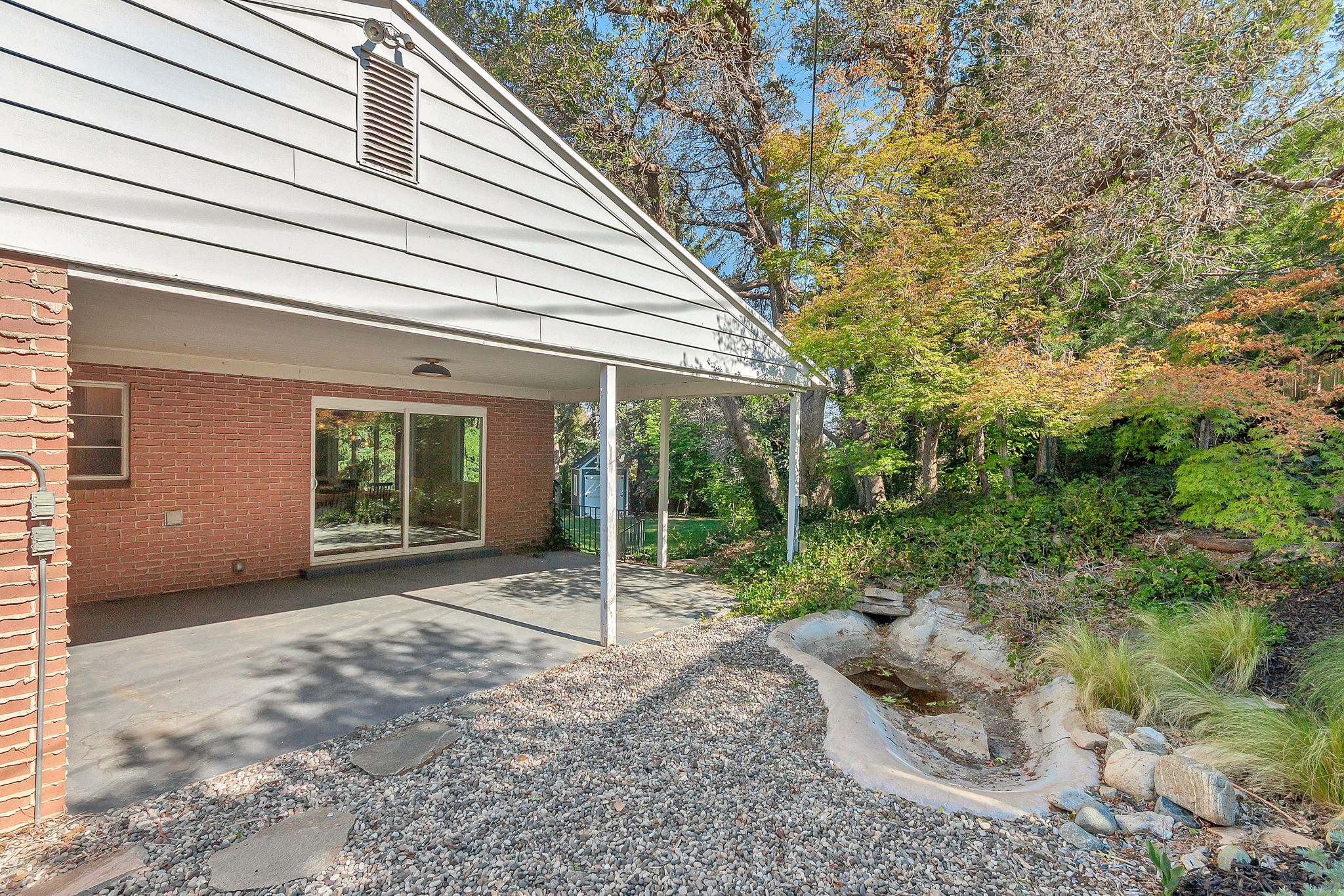 Covered patio featuring a concrete surface and direct access via sliding glass doors