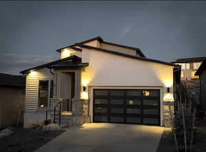 Modern exterior featuring stucco siding and horizontal paneling
