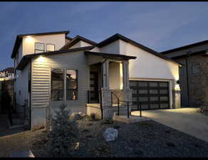 Contemporary exterior featuring clean lines, stucco, and horizontal siding